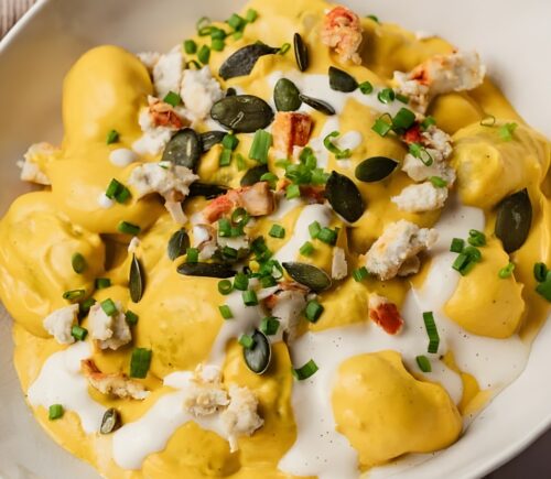 cream of pumpkin gnocchi with vegan cheese and pumpkin seeds