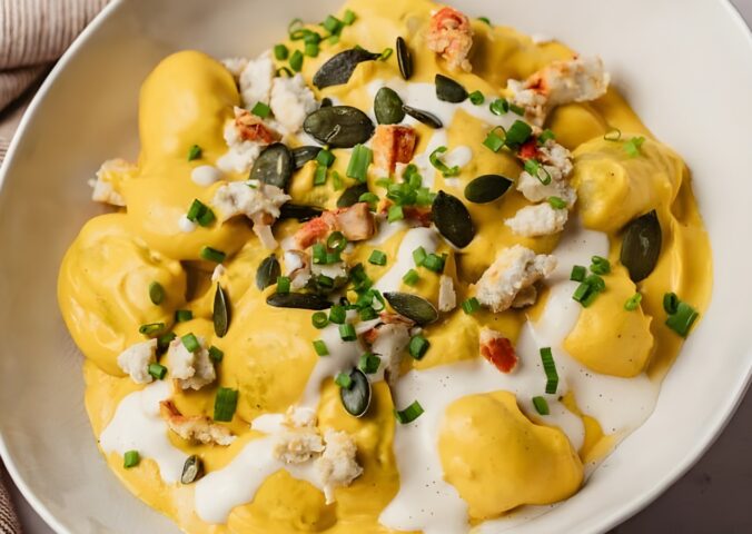 cream of pumpkin gnocchi with vegan cheese and pumpkin seeds
