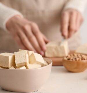 Photo shows someone's hands as they prepare tofu at home in the kitchen. Market Data Forecast predicts that the European tofu market could surpass $2 billion by 2034