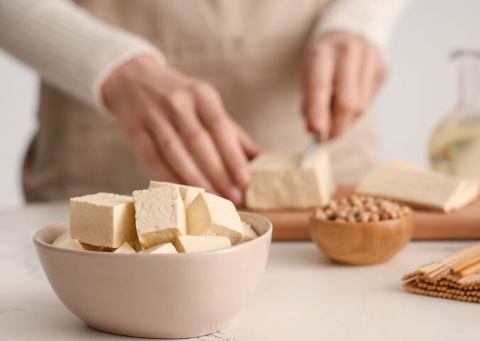 Photo shows someone's hands as they prepare tofu at home in the kitchen. Market Data Forecast predicts that the European tofu market could surpass $2 billion by 2034