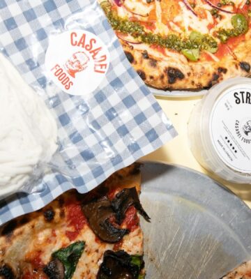 Photo shows Casadei's Stracciatella in a large block, in a tub, and on top of a selection of fresh vegan pizzas. The UK's Everyman Cinemas has added Casadei Foods' vegan Stracciatella to the pizza menu nationwide