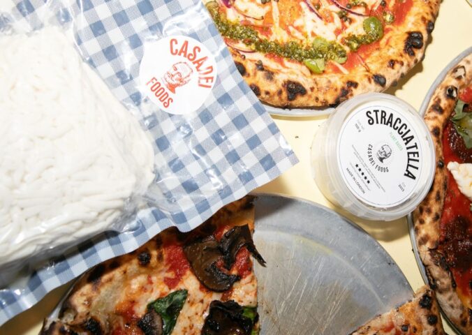Photo shows Casadei's Stracciatella in a large block, in a tub, and on top of a selection of fresh vegan pizzas. The UK's Everyman Cinemas has added Casadei Foods' vegan Stracciatella to the pizza menu nationwide