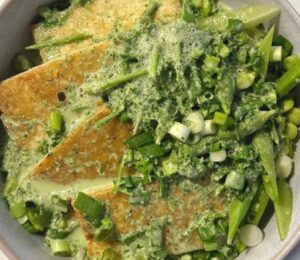 herb miso coconut bowl with edamame, sugar snap peas, and more