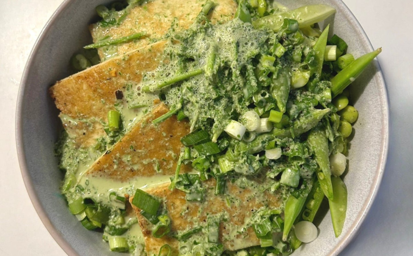 herb miso coconut bowl with edamame, sugar snap peas, and more