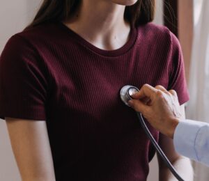 Photo shows a doctor listening to a young woman's heart with a stethoscope. A new study has found that low carb and low fat diets can lower your risk of heart disease, but only if they are rich in nutrient-dense plant-based foods