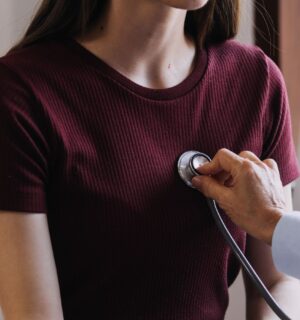 Photo shows a doctor listening to a young woman's heart with a stethoscope. A new study has found that low carb and low fat diets can lower your risk of heart disease, but only if they are rich in nutrient-dense plant-based foods