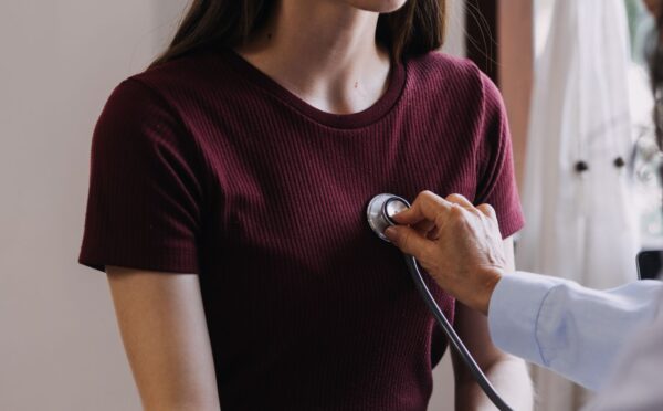 Photo shows a doctor listening to a young woman's heart with a stethoscope. A new study has found that low carb and low fat diets can lower your risk of heart disease, but only if they are rich in nutrient-dense plant-based foods