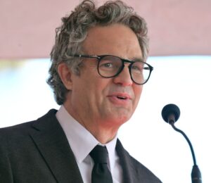 Photo shows actor Mark Ruffalo speaking into a microphone. Mark Ruffalo recently tried a vegan Greggs sausage roll while appearing on JOE’s “The British Test."