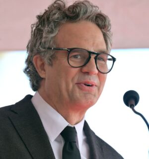 Photo shows actor Mark Ruffalo speaking into a microphone. Mark Ruffalo recently tried a vegan Greggs sausage roll while appearing on JOE’s “The British Test."