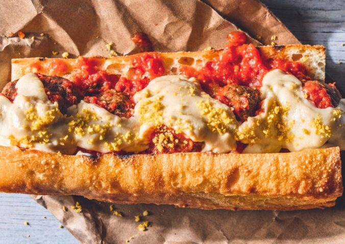 a vegan meatball parmigiana hero with cashew mozzarella, lentil meatballs, and basil for recipes that use nutritional yeast