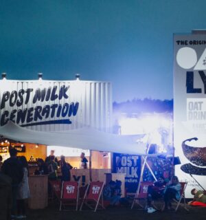 Photo shows a huge Oatly display at a festival that includes the slogan "post-milk generation." Following the Supreme Court's ruling this week, Oatly will no longer be allowed to use the word "milk" at all when marketing or labeling its products in the UK