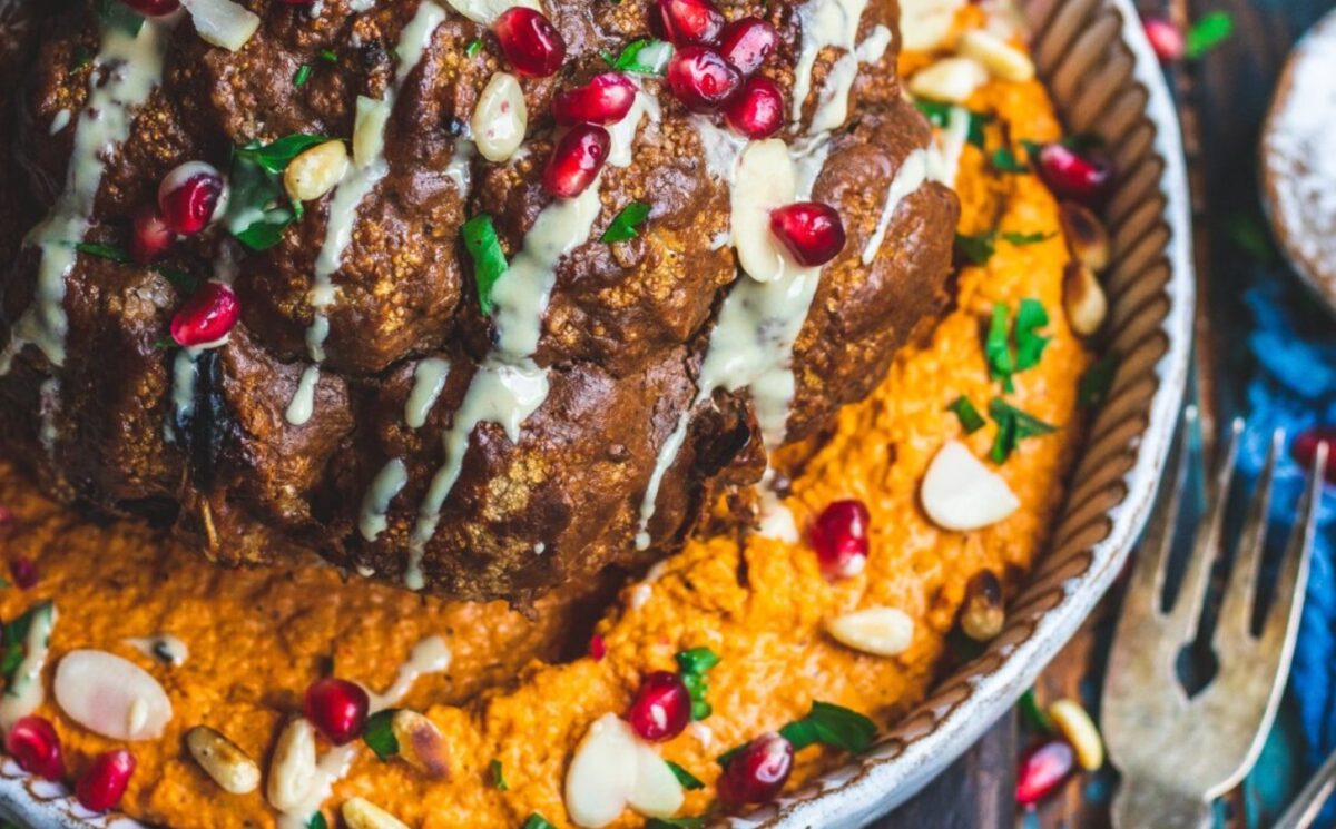 whole roasted cauliflower with harissa and red pepper hummus