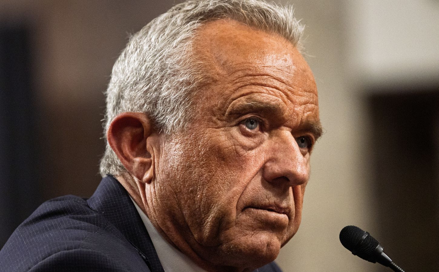 Photo shows RFK Jr speaking into a microphone. RFK Jr recently revealed he follows a carnivore diet