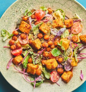 roasted chickpea and tofu salad with tomatoes, avocado, maple syrup, and tahini