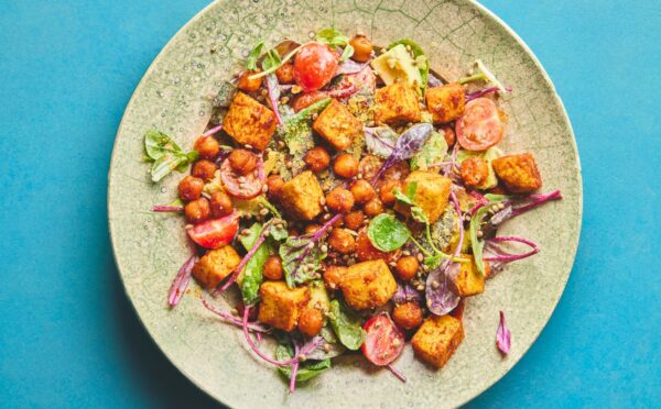 roasted chickpea and tofu salad with tomatoes, avocado, maple syrup, and tahini