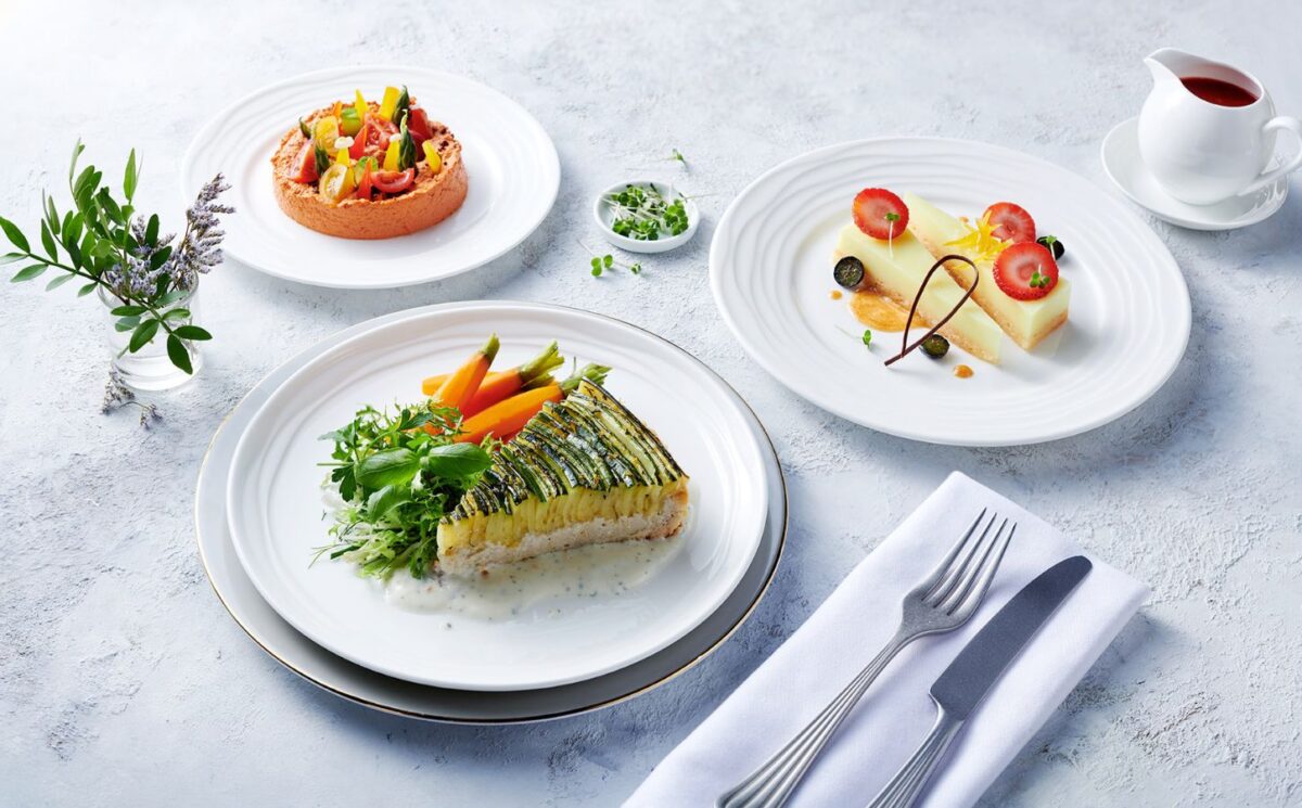 Photo shows the zucchini tart, which is one of the nearly 500 plant-based options now available on Emirates flights. The airline is doubling down on vegan airplane food in 2026