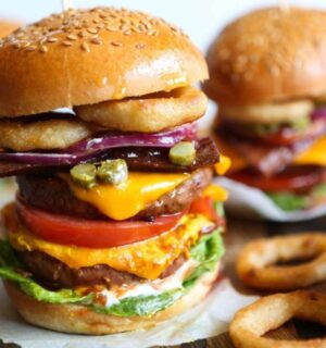 a meat-free mega burger stacked with dairy-free cheese, salad, and onion rings for recipes that aren't bowls or salads