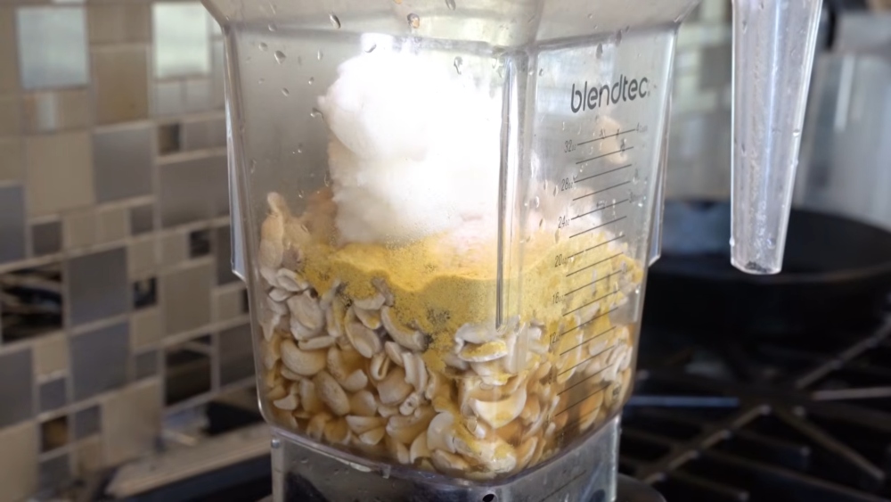 Cashews, flat beer, coconut oil, miso, and nutritional yeast in a blender to prep Miyoko's vegan roadhouse cheddar