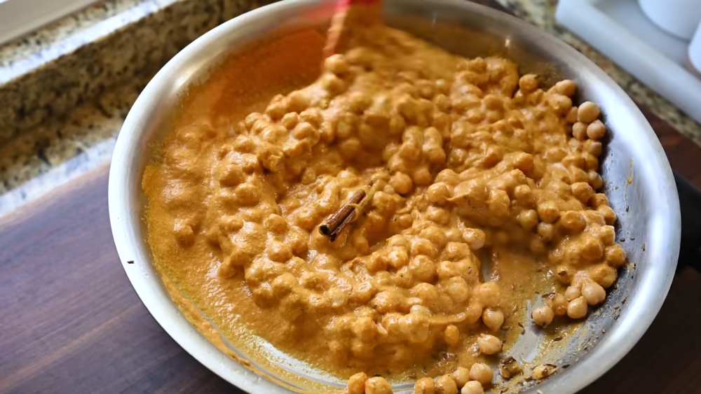 Butter chickpeas in a pan, this is one of the dishes Vora makes with her flavor bombs, the ultimate freezer hack for weeknight cooking