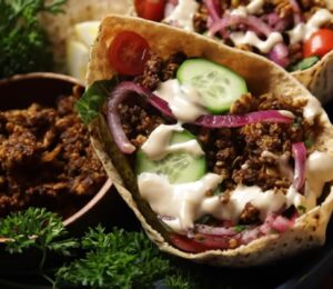 The vegan shawarma recipe comes to life in these pitas filled with shredded crispy tofu, cucumber, tomatoes, sumac onions, and drizzled with tahini sauce