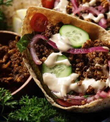 The vegan shawarma recipe comes to life in these pitas filled with shredded crispy tofu, cucumber, tomatoes, sumac onions, and drizzled with tahini sauce