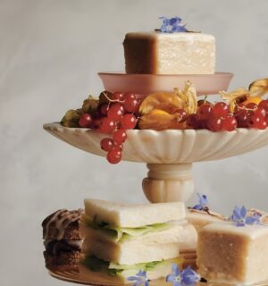 a picture of almond tea cakes made with marzipan, apricot jam, and topped with flowers for your next tea party