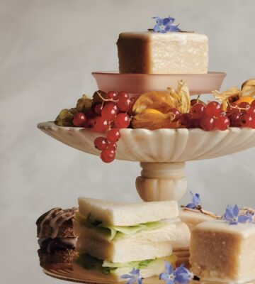 a picture of almond tea cakes made with marzipan, apricot jam, and topped with flowers for your next tea party