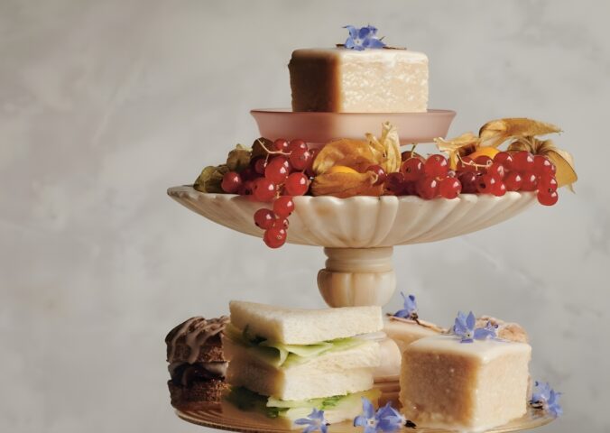 a picture of almond tea cakes made with marzipan, apricot jam, and topped with flowers for your next tea party