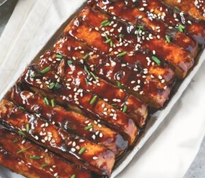 a picture of vegan char siu tofu made with hoisin sauce and five spice for Chinese-inspired dishes