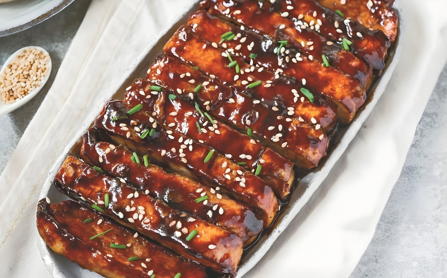 a picture of vegan char siu tofu made with hoisin sauce and five spice for Chinese-inspired dishes
