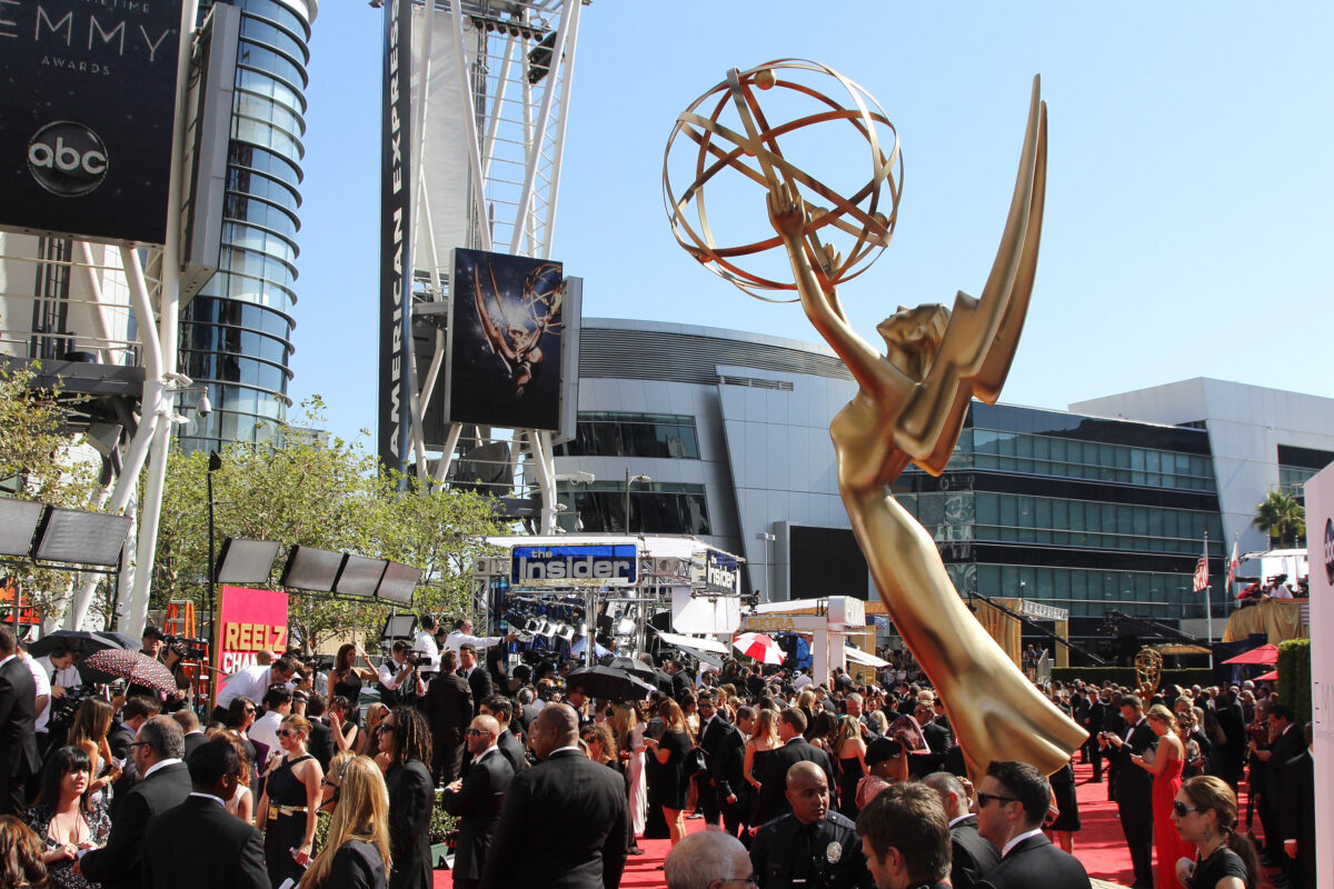 Photo shows a large group of people in formal clothes at the 2018 Emmy Awards, or the "Emmys," as organized by The Academy of Television Arts & Sciences (ATAS). The Emmys will be fur-free from this year