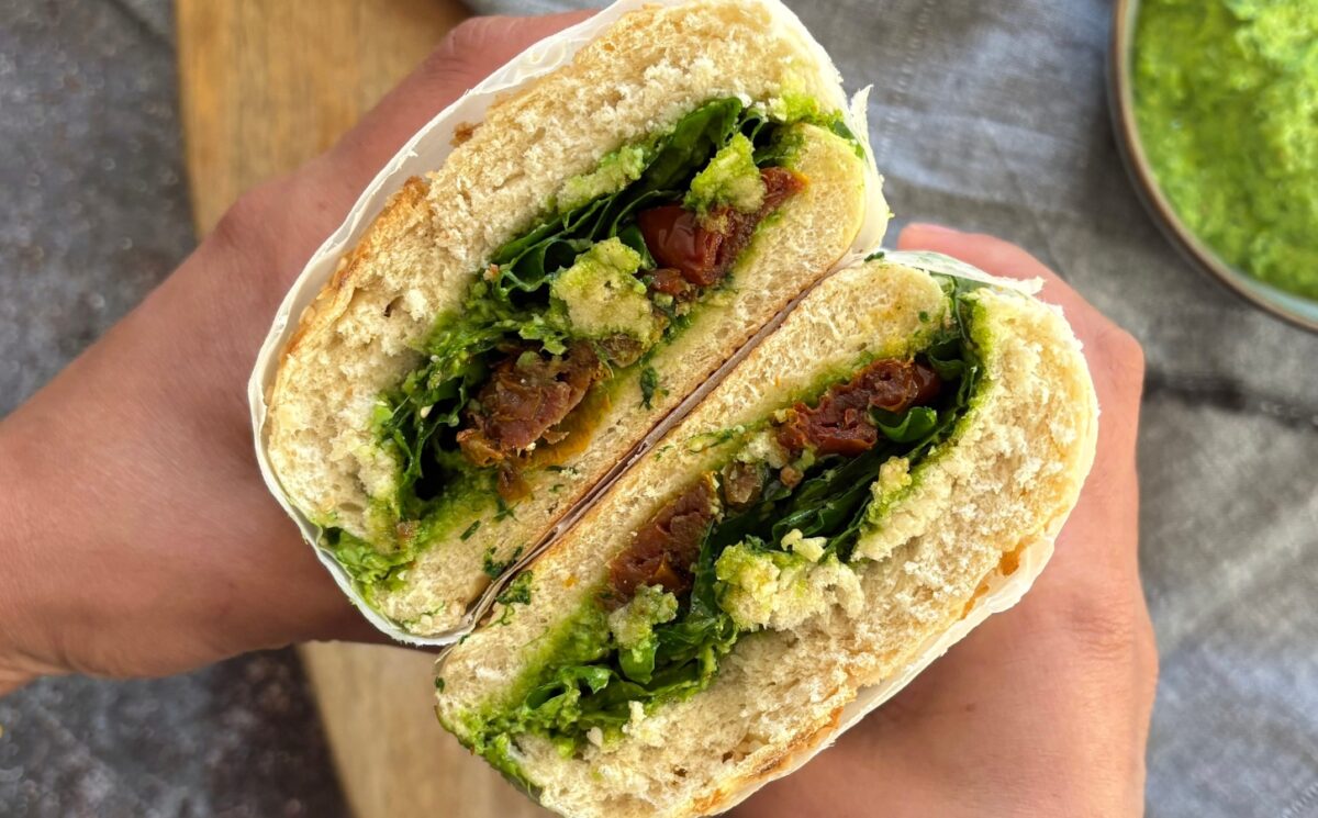 Herby Edamame And Sun-Dried Tomato Sandwich with fresh arugula