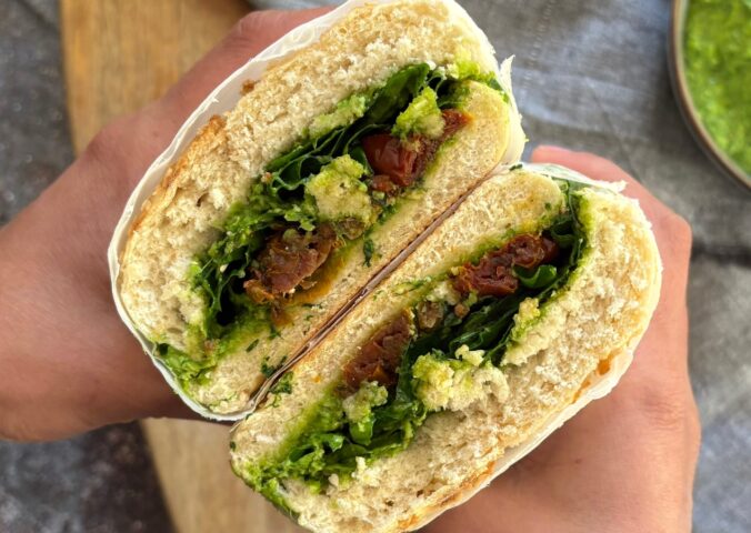 Herby Edamame And Sun-Dried Tomato Sandwich with fresh arugula