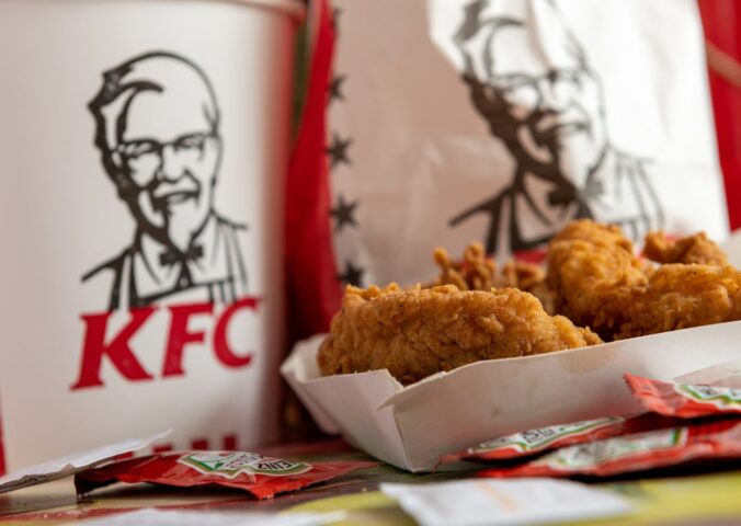 Photo shows a box of KFC chicken in front of KFC branded packaging. Several major fast-food brands have scrapped a key animal welfare pledge to move away from “frankenchickens,” including Nando’s and KFC.