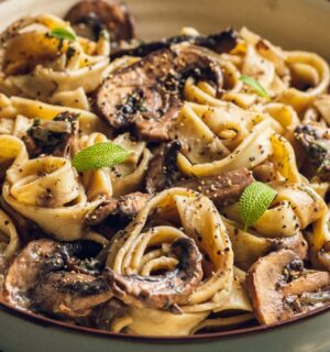 A plate of mushroom and sage pasta cooked to a dairy-free and vegan recipe for lazy vegan dinners