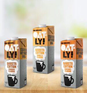 Photo shows some of the new Oatly Barista Edition oat milk flavors, including Vanilla, Caramel, Coconut, Churros and Popcorn. Oatly also announced that 2025 was its first profitable year