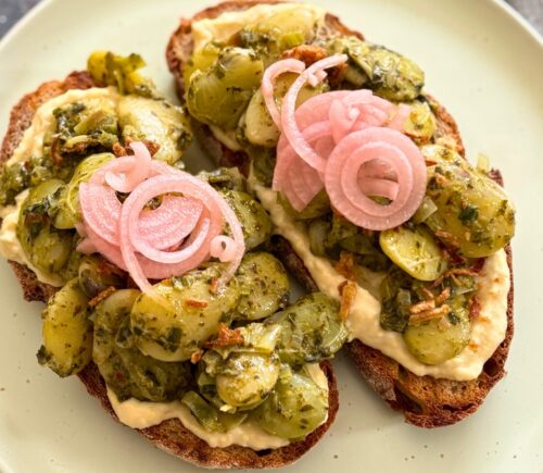 vegan pesto butter beans with leeks, onions, nutritional yeast ,etc