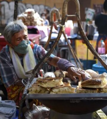 Photo shows a screengrab of a woman preparing street food taken from the docuseries 'Thai Street Food: Best Kept Secrets,' which has become one of the most-watched shows on HBO Max Asia within days of its release