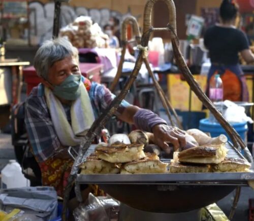 Photo shows a screengrab of a woman preparing street food taken from the docuseries 'Thai Street Food: Best Kept Secrets,' which has become one of the most-watched shows on HBO Max Asia within days of its release
