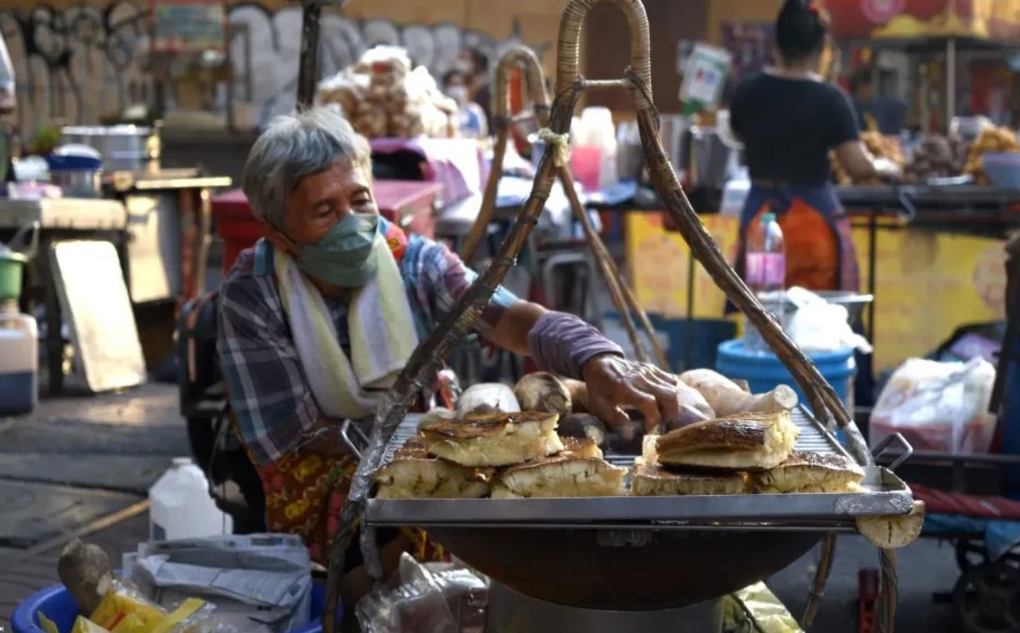 Photo shows a screengrab of a woman preparing street food taken from the docuseries 'Thai Street Food: Best Kept Secrets,' which has become one of the most-watched shows on HBO Max Asia within days of its release