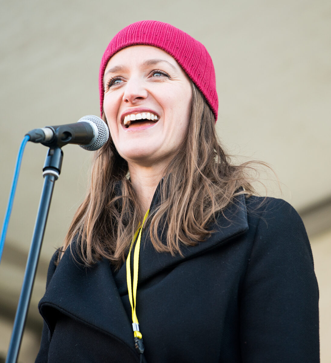 Photo shows vegan comedian Sara Pascoe speaking at a Women's March in Trafalgar Square, London, as part of an international day of solidarity and protests against US President Donald Trump
