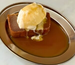 sticky toffee butter mochi with ice cream and caramel sauce