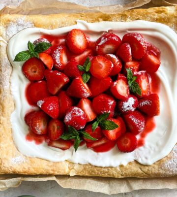 a vegan strawberry galette with dairy-free whipped cream