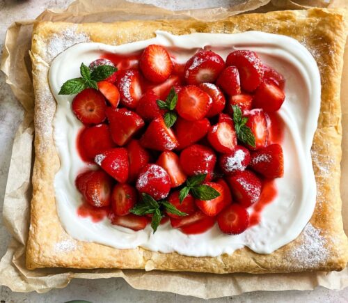 a vegan strawberry galette with dairy-free whipped cream