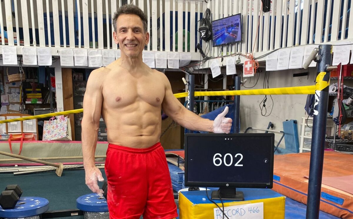 Photo shows vegan bodybuilder and former gymnast Joe DeMarco, who has set a new Guinness World Record at the age of 61 by performing 602 “toes to bar” movements in one hour