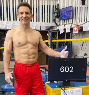 Photo shows vegan bodybuilder and former gymnast Joe DeMarco, who has set a new Guinness World Record at the age of 61 by performing 602 “toes to bar” movements in one hour