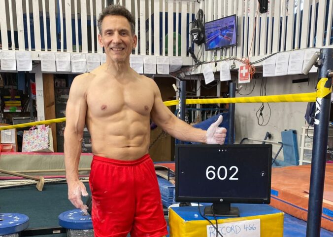 Photo shows vegan bodybuilder and former gymnast Joe DeMarco, who has set a new Guinness World Record at the age of 61 by performing 602 “toes to bar” movements in one hour