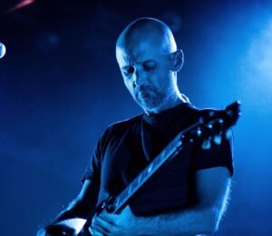Photo shows Moby performing onstage. Vegan Camp Out has announced that Moby will speak at this year’s festival.