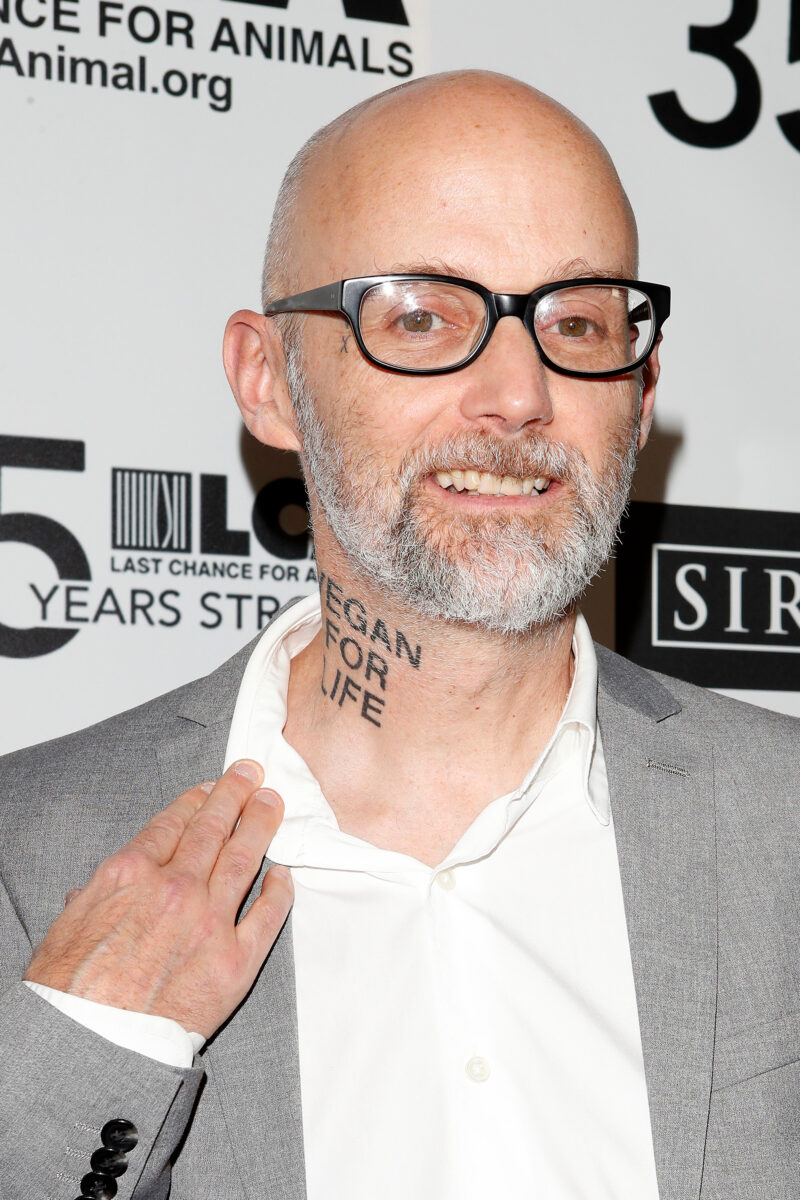 Photo shows Moby, who is now due to speak at this year's Vegan Camp Out, pulling down his collar to show a tattoo that reads "vegan for life"