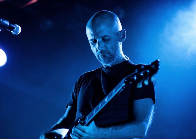Photo shows Moby performing onstage. Vegan Camp Out has announced that Moby will speak at this year’s festival.